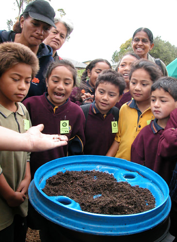 Maori children learning about worms